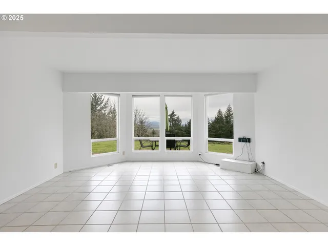 a view of an empty room and window