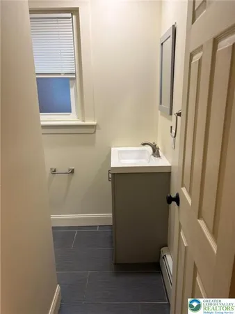 a bathroom with a sink and toilet
