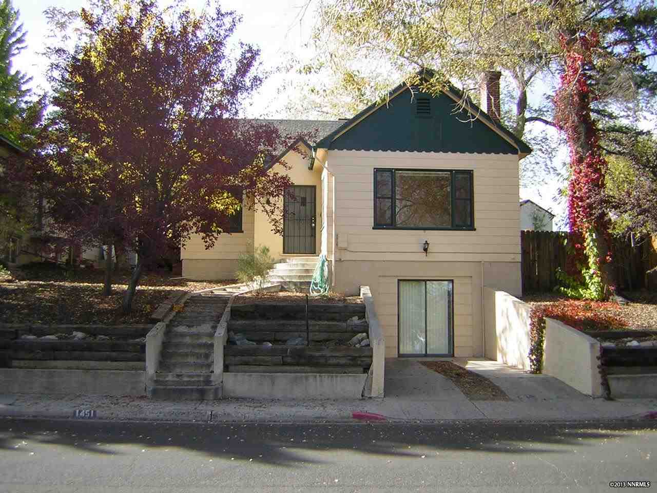 a front view of a house with parking space