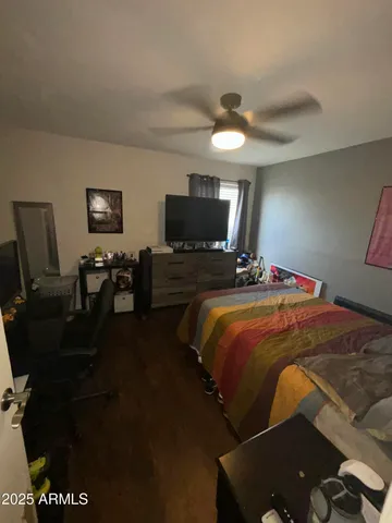 a bedroom with a bed and tv