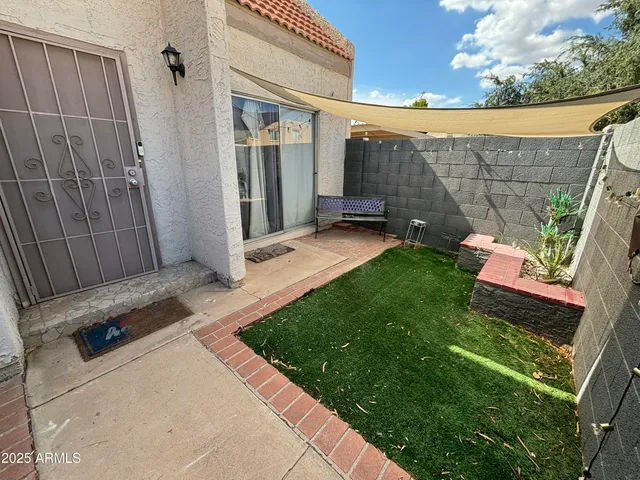 a backyard of a house with seating space