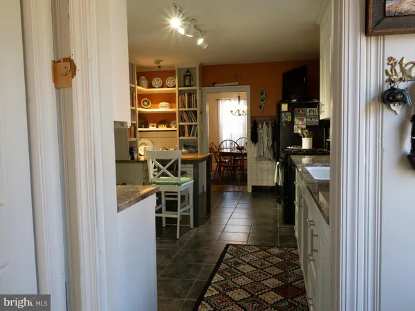 a spacious bedroom with a bed a couch and a window