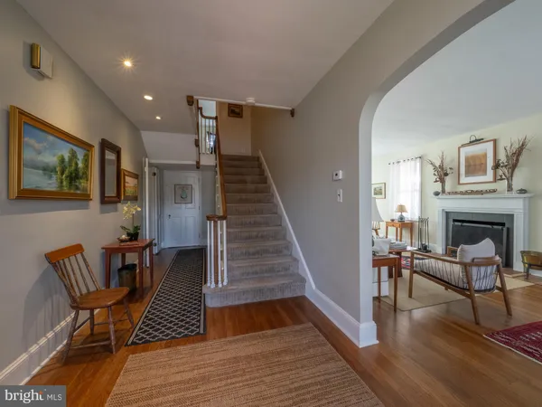a spacious bedroom with a bed a couch and a flat tv screen