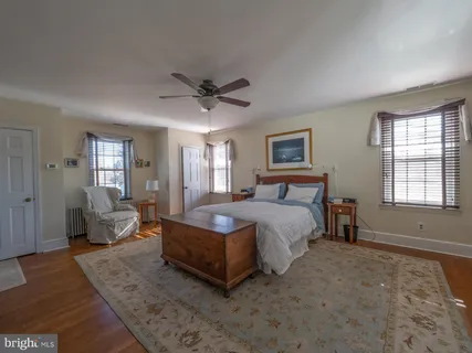 a bedroom with a bed and a television