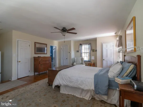 a view of entryway with wooden floor and a front door