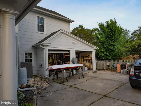 a living room with furniture a window and a chandelier