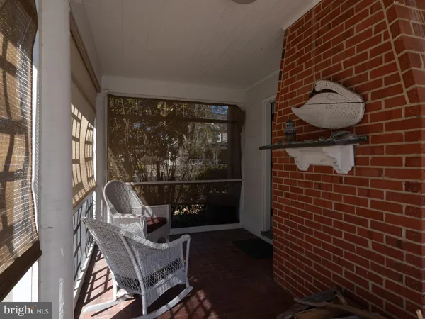 a view of a house with a big yard and flower plants