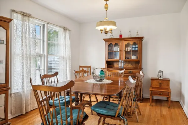 a kitchen with stainless steel appliances kitchen island granite countertop a sink stove and wooden cabinets