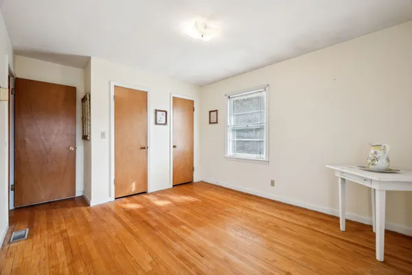 a living room with furniture and large windows