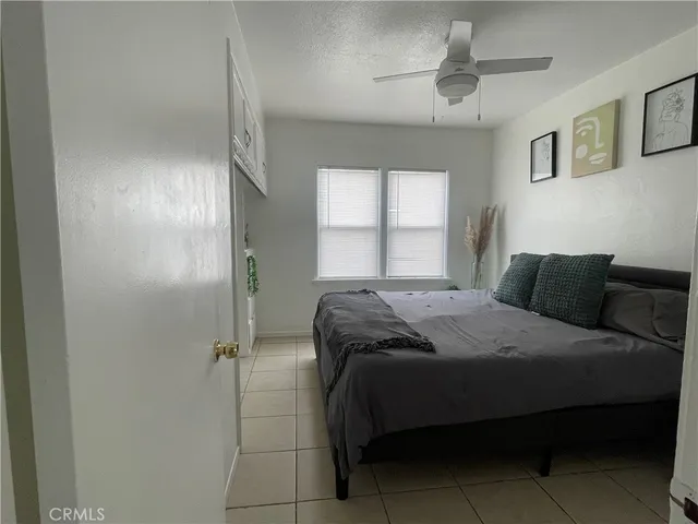 a kitchen with a stove cabinets and a refrigerator