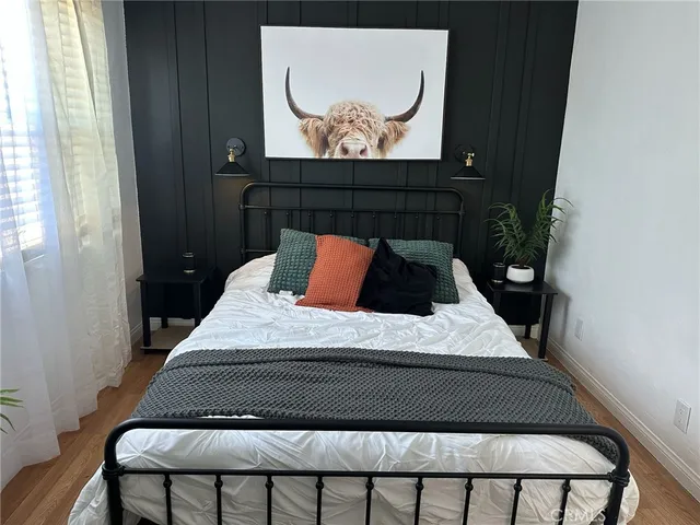 a bedroom with a bed and a window