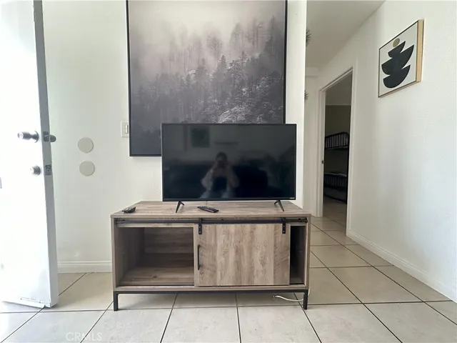 a bedroom with a bed and a table