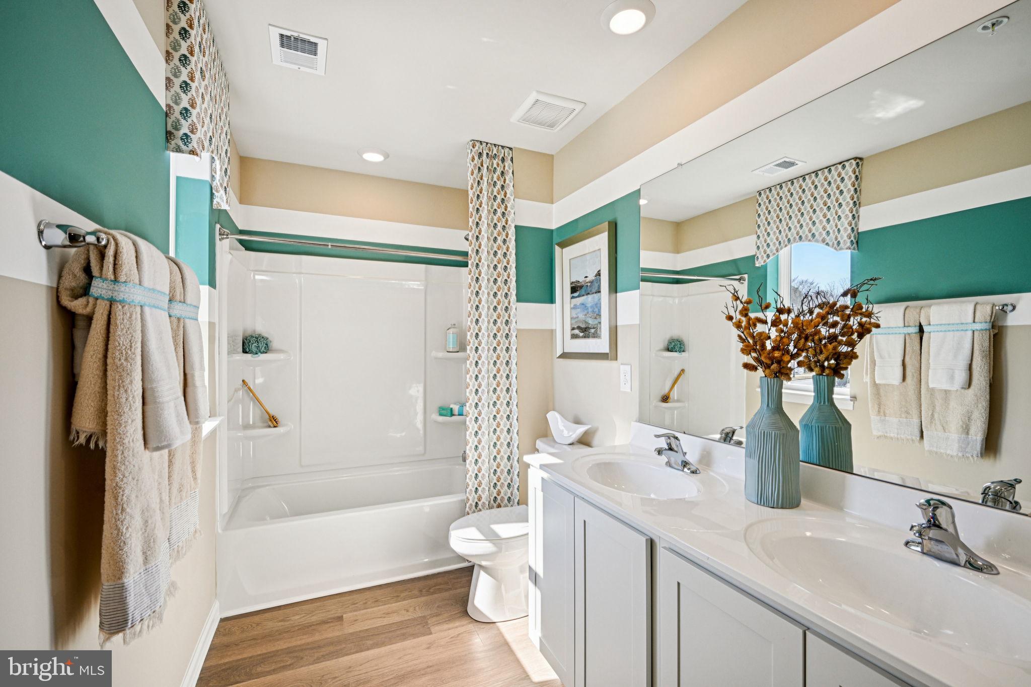 1153 Wintermead Loop Salisbury, MD 21801 - Photo 23 of 33 a bathroom with a sink a toilet and shower
