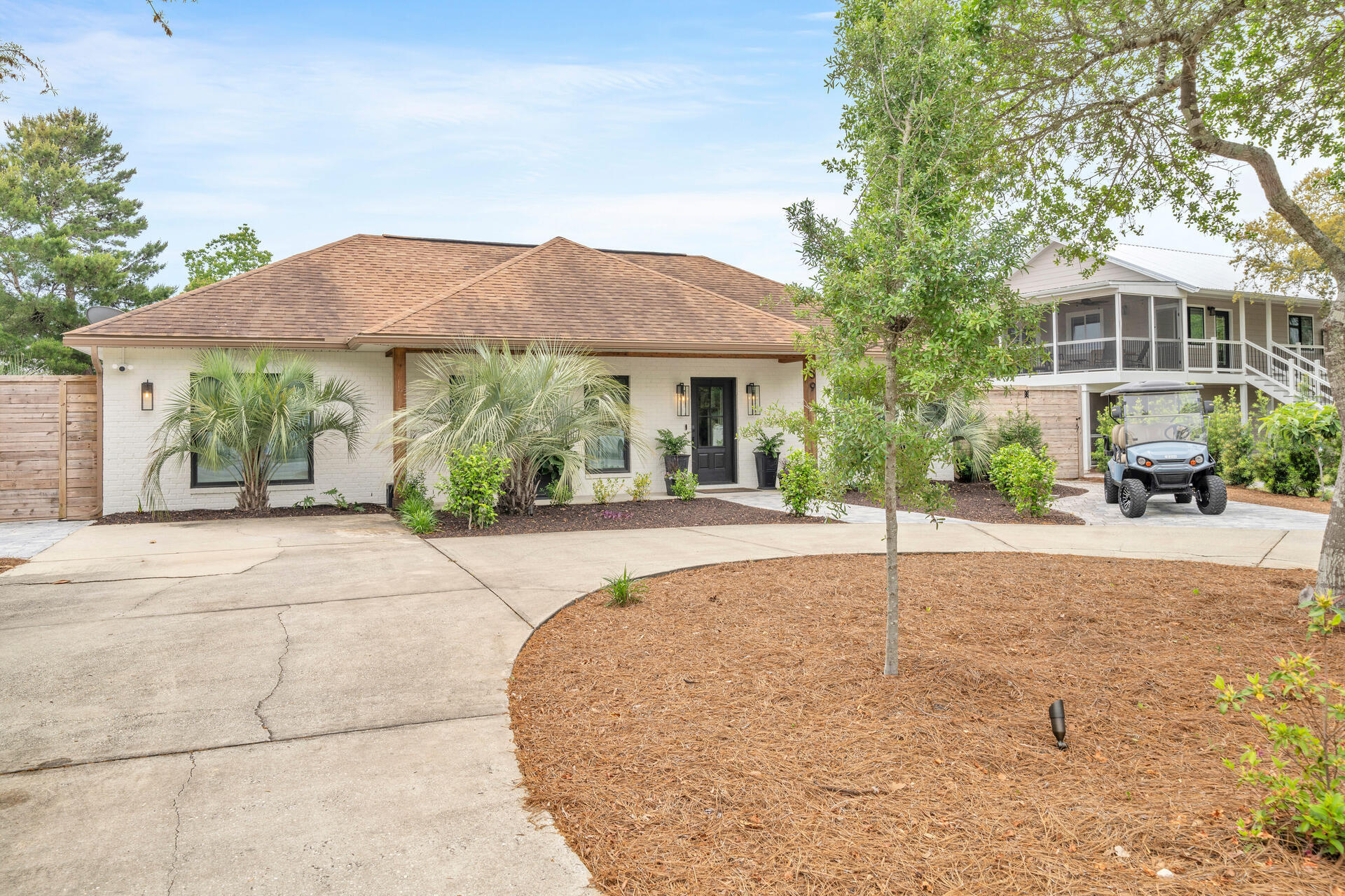 59 Woodland Drive Santa Rosa Beach, FL 32459 - Photo 3 of 42 a house view with a garden space