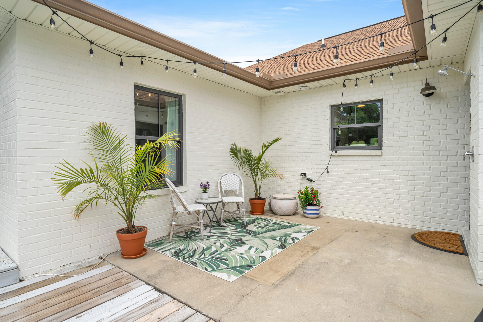 59 Woodland Drive Santa Rosa Beach, FL 32459 - Photo 40 of 42 a view of a outdoor seating area with potted plants