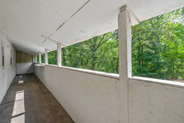 a view of balcony with furniture