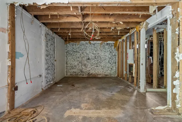 a view of a garage with wooden walls