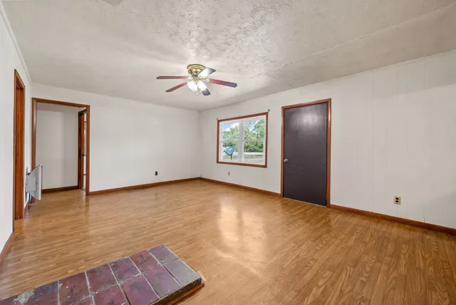 a view of an empty room with a window