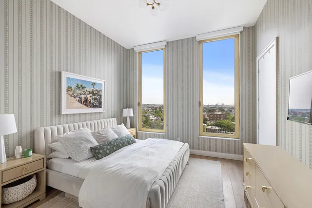 a bathroom with a sink mirror and vanity
