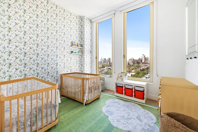 a spacious bathroom with a double vanity sink a mirror and a shower
