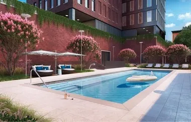 a bathroom with a white bath tub a toilet and a sink