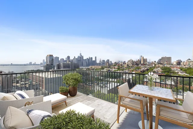 a kitchen with granite countertop a stove a sink and a refrigerator