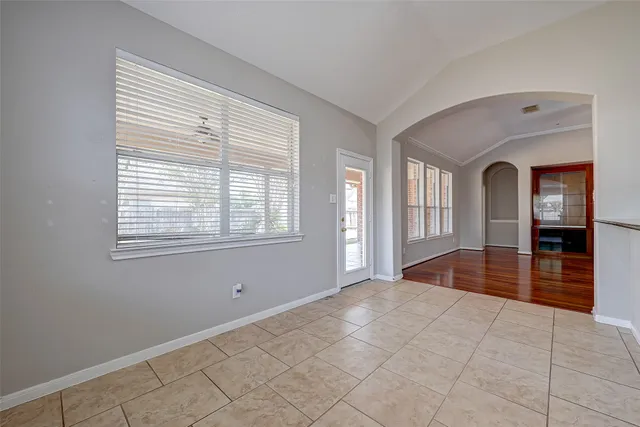 a kitchen with stainless steel appliances granite countertop a refrigerator sink and stove