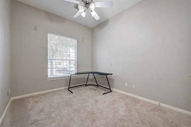 a view of a livingroom with a workspace