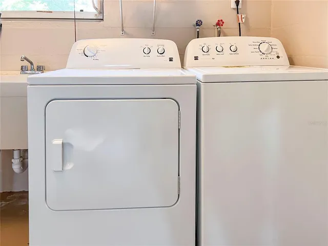 a utility room with dryer and washer