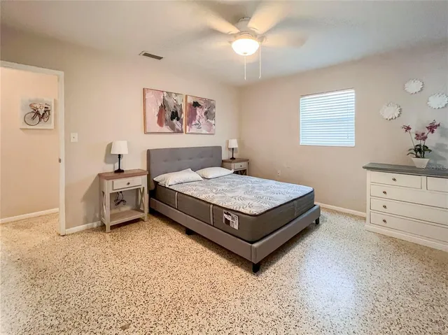 a living room with furniture and a dresser