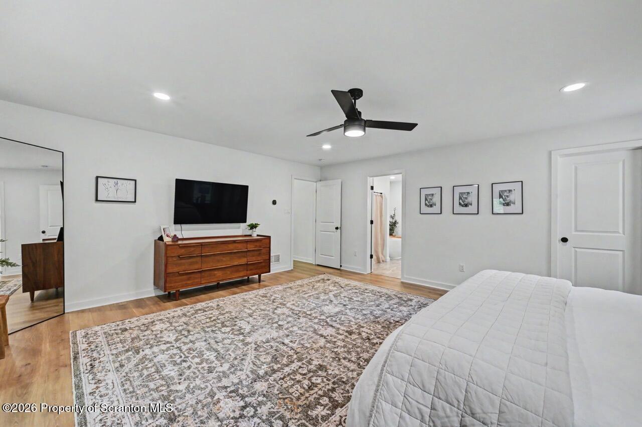 100 Highland Road Moscow, PA 18444 - Photo 47 of 85 a bedroom with a bed and a flat screen tv