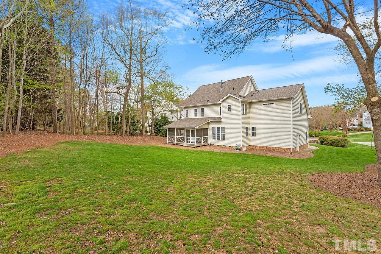 214 Silver Lining Lane Cary, NC 27513 - Photo 3 of 3 a view of a house with a big yard and large tree
