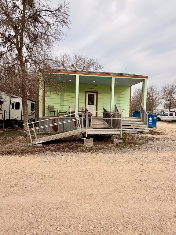 270 Hidden Path Lockhart, TX 78644 - Photo 4 of 27 a backyard of a house with barbeque oven table and chairs