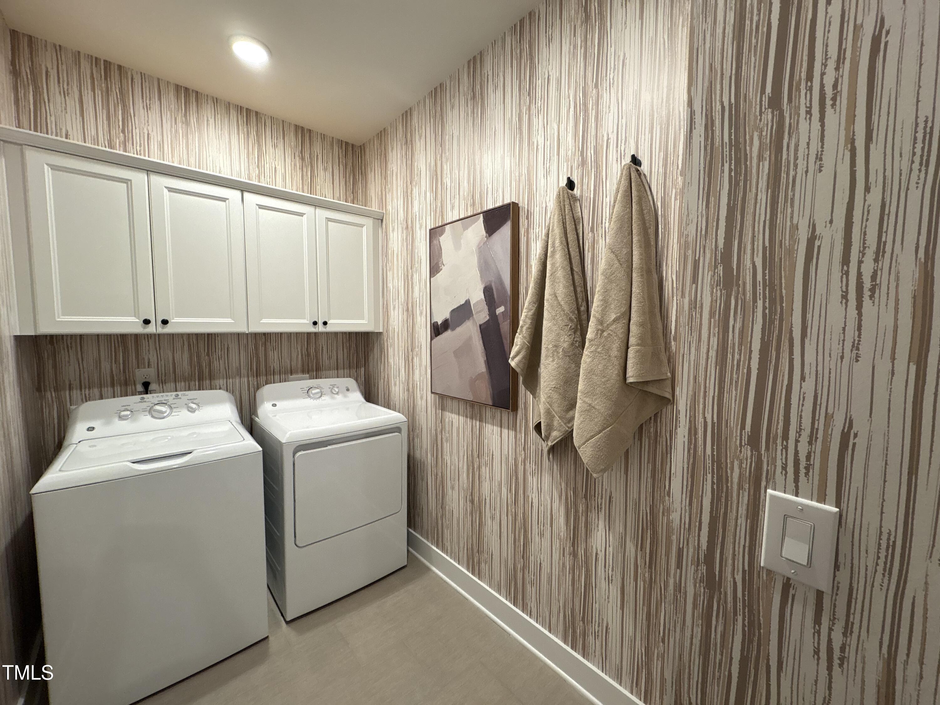 10907 Bayflower Way Raleigh, NC 27617 - Photo 14 of 22 a utility room with dryer and washer