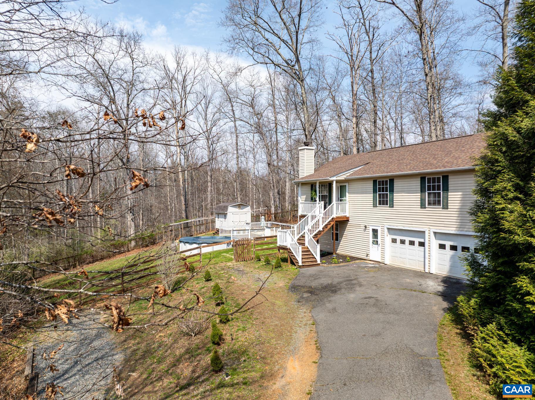 1029 West Daffodil Road Ruckersville, VA 22968 - Photo 2 of 39 a view of a house with pool and sitting area