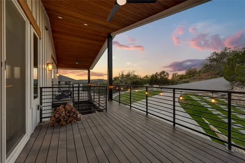 a view of a balcony with wooden floor