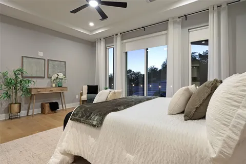 a bedroom with a large bed and a fireplace