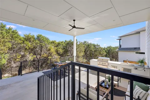 a view of a balcony with furniture