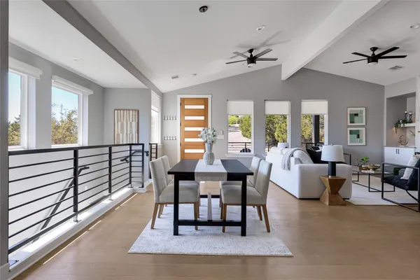 a living room with furniture kitchen view and a view of kitchen