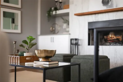 a view of living room with furniture and a potted plant