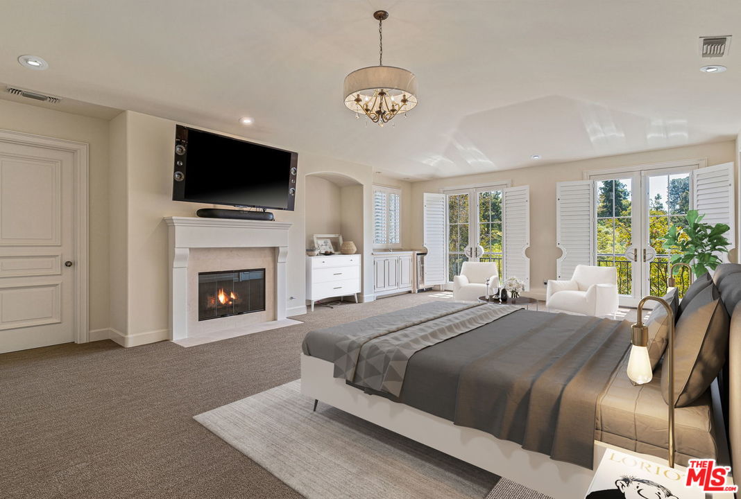 702 Patterson Place Pacific Palisades, CA 90272 - Photo 12 of 18 a spacious bedroom with a large bed and a flat screen tv