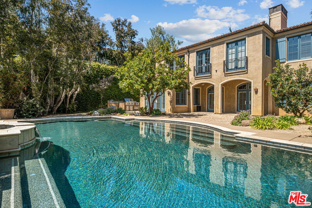 702 Patterson Place Pacific Palisades, CA 90272 - Photo 18 of 18 a house view with swimming pool in front of it
