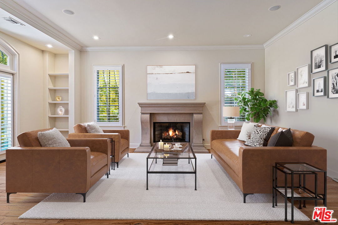 702 Patterson Place Pacific Palisades, CA 90272 - Photo 7 of 18 a living room with furniture and a fireplace