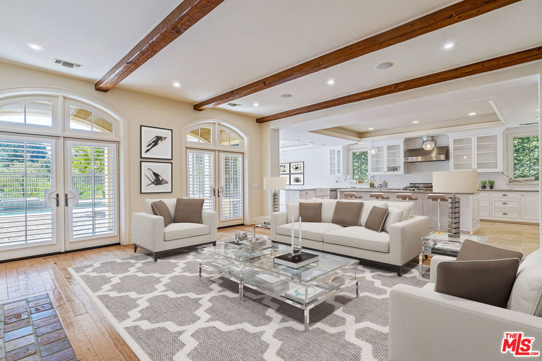 702 Patterson Place Pacific Palisades, CA 90272 - Photo 9 of 18 a living room with furniture and large windows