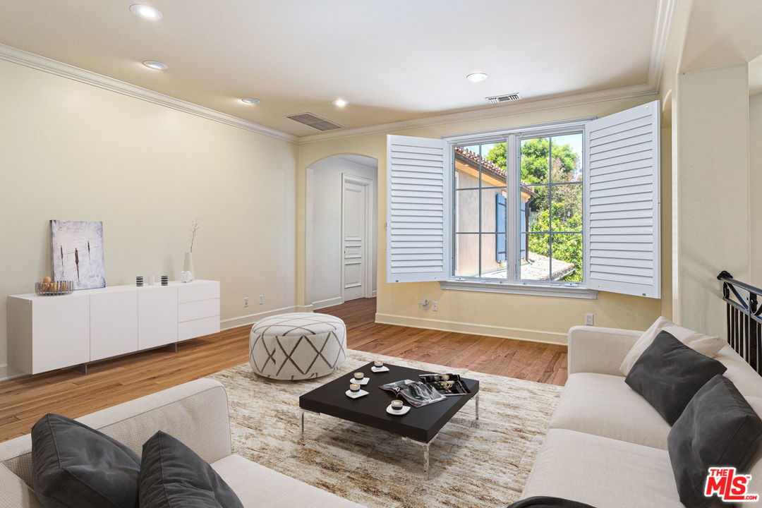 702 Patterson Place Pacific Palisades, CA 90272 - Photo 10 of 18 a living room with furniture and a window