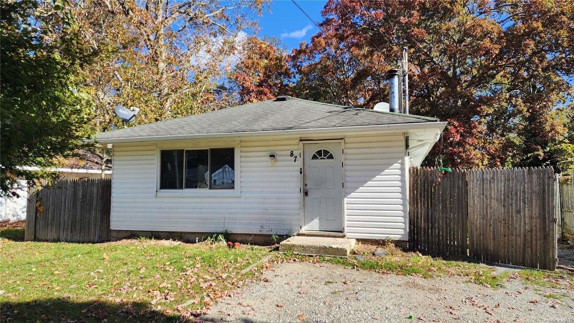 87 Flower Road Mastic Beach, NY 11951 - Photo 1 of 1 a backyard of a house