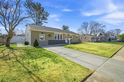 a view of house with yard and entertaining space