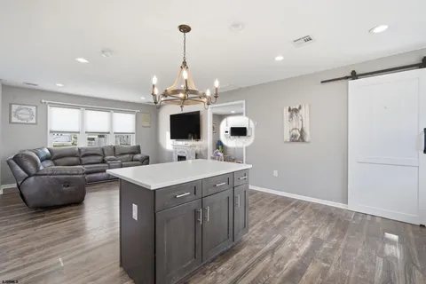 a kitchen with a sink appliances and cabinets