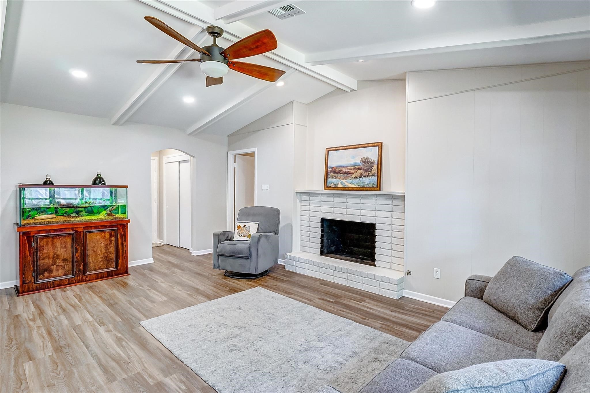 9218 Hammerly Boulevard Houston, TX 77080 - Photo 12 of 40 a living room with furniture and a fireplace
