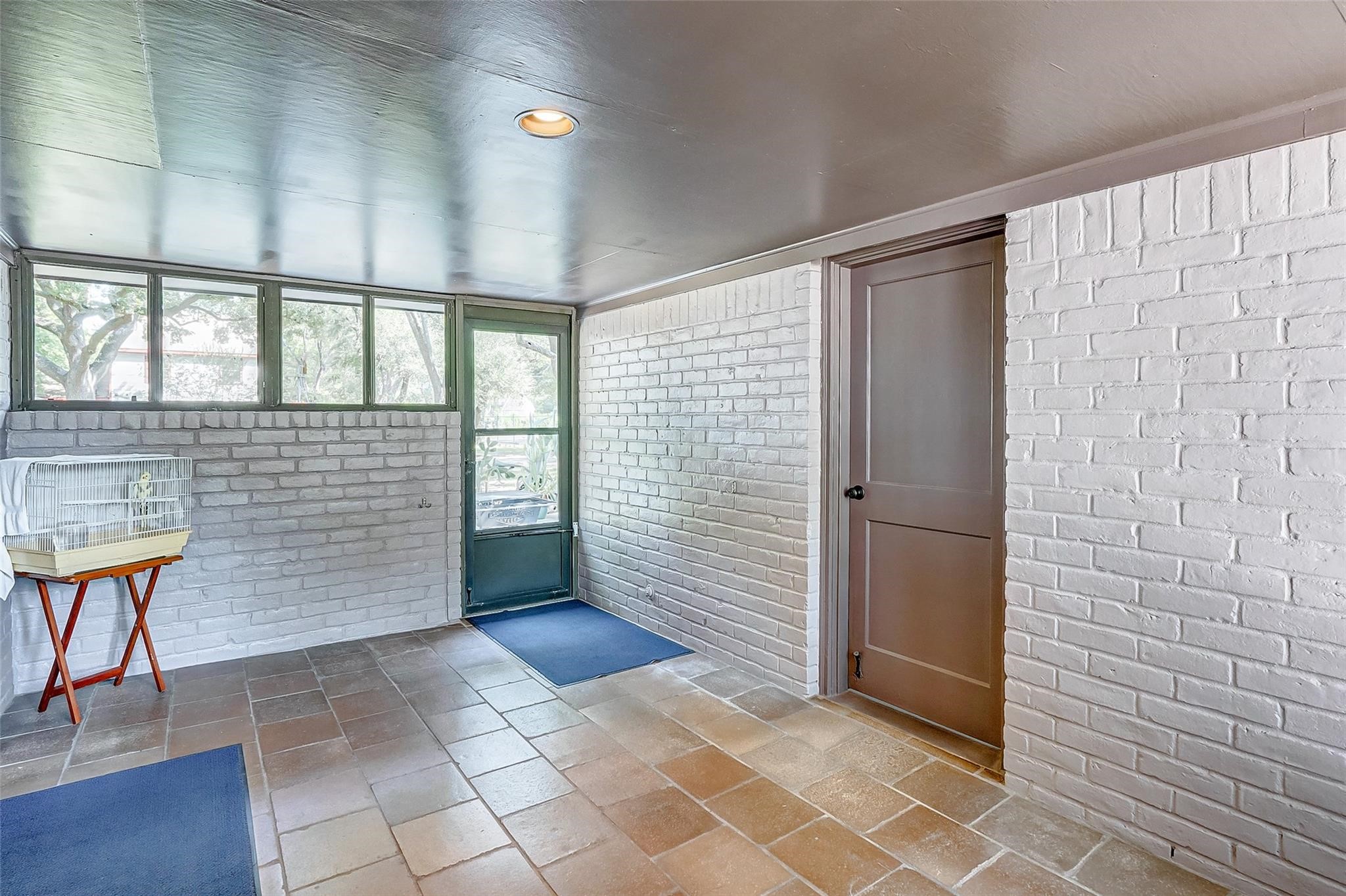 9218 Hammerly Boulevard Houston, TX 77080 - Photo 31 of 40 a view of an empty room and bathroom with wooden floor